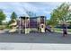 Community playground featuring climbing structures, slides, and a bridge provide a fun outdoor play area at 10227 Sunset Gardens Dr, Las Vegas, NV 89135