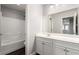 Bathroom featuring a shower-tub combo and a vanity with storage space at 10805 Knickerbocker Ave, Las Vegas, NV 89166