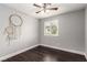 Bright bedroom featuring a ceiling fan and a window with shutters at 10805 Knickerbocker Ave, Las Vegas, NV 89166