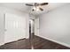 Bright bedroom with hardwood floors, a ceiling fan, and white trim at 10805 Knickerbocker Ave, Las Vegas, NV 89166