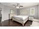 Bedroom showcasing a decorative headboard, hardwood floors, and a window at 10805 Knickerbocker Ave, Las Vegas, NV 89166