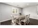 Dining room with hardwood floors and a window with lots of natural light at 10805 Knickerbocker Ave, Las Vegas, NV 89166