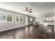 Open concept living area featuring dark hardwood floors and ample natural light at 10805 Knickerbocker Ave, Las Vegas, NV 89166