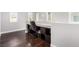 Office featuring hardwood floors, a built-in desk, and natural light at 10805 Knickerbocker Ave, Las Vegas, NV 89166