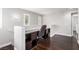 Office featuring hardwood floors, a built-in desk, and natural light at 10805 Knickerbocker Ave, Las Vegas, NV 89166
