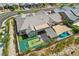 Aerial view of a home with a basketball court, patio, pool, and shade sail, showcasing a private backyard oasis at 11181 Luna Blanca Dr, Las Vegas, NV 89138