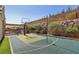 Backyard basketball court alongside a pool, dining area, and mountain views, perfect for recreation at 11181 Luna Blanca Dr, Las Vegas, NV 89138