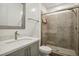 Bathroom featuring a glass-door shower, modern fixtures, and a granite countertop at 11181 Luna Blanca Dr, Las Vegas, NV 89138
