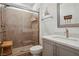 Bathroom features a glass-enclosed shower, neutral tile, and vanity at 11181 Luna Blanca Dr, Las Vegas, NV 89138