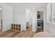Bright, modern bedroom with hardwood floors, a closet, and a built-in shelf storage at 11181 Luna Blanca Dr, Las Vegas, NV 89138