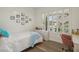 Bedroom featuring natural light, hardwood floors, and a writing desk at 11181 Luna Blanca Dr, Las Vegas, NV 89138
