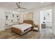 Bright bedroom with a woven bed frame, recessed lights, ceiling fan and built-in decorative shelving at 11181 Luna Blanca Dr, Las Vegas, NV 89138