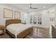 Bright bedroom showcasing a woven bed frame, recessed lights, ceiling fan, and natural light from windows at 11181 Luna Blanca Dr, Las Vegas, NV 89138
