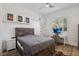 Cozy bedroom with a wooden bed frame, a work desk, and natural light at 11181 Luna Blanca Dr, Las Vegas, NV 89138