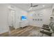 Relaxing bonus room with ceiling fan, movie chairs, TV and shuttered windows at 11181 Luna Blanca Dr, Las Vegas, NV 89138