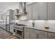 Bright kitchen featuring stainless steel appliances, gray cabinets, and lots of storage space at 11181 Luna Blanca Dr, Las Vegas, NV 89138