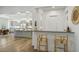 Bright, open kitchen with stainless steel appliances, pendant lighting, and an eat-in island at 11181 Luna Blanca Dr, Las Vegas, NV 89138