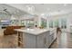 Bright, open-concept kitchen featuring a large island, stainless steel appliances, and seamless flow to the living space at 11181 Luna Blanca Dr, Las Vegas, NV 89138