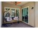 Enjoy this cozy outdoor space with hanging swing chairs, ceiling fans, and recessed lighting at 11181 Luna Blanca Dr, Las Vegas, NV 89138