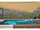 Beautiful pool featuring a tanning ledge and a barbecue, creating the ideal backyard retreat at 11181 Luna Blanca Dr, Las Vegas, NV 89138