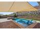 Sparkling pool features a tanning ledge and a beautiful backyard space perfect for entertaining at 11181 Luna Blanca Dr, Las Vegas, NV 89138