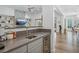 Modern wet bar with a wine fridge, sink and ample countertop space at 11181 Luna Blanca Dr, Las Vegas, NV 89138