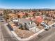 Aerial view of the home showcasing the roof, surrounding landscaping, and neighborhood at 1209 Shifting Sands Dr, Las Vegas, NV 89108