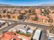 Inviting single-Gathering home featuring a quaint backyard area, complemented by mature trees and ample parking at 1209 Shifting Sands Dr, Las Vegas, NV 89108