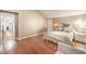 Bedroom featuring stylish wallpaper, wood floors, and natural light at 1209 Shifting Sands Dr, Las Vegas, NV 89108