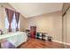 Bedroom featuring wood floors, large windows, and ample closet space at 1209 Shifting Sands Dr, Las Vegas, NV 89108