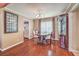 Formal dining room with elegant furnishings and hardwood floors at 1209 Shifting Sands Dr, Las Vegas, NV 89108