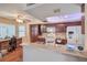 Traditional kitchen with wooden cabinets, breakfast bar, and desk space at 1209 Shifting Sands Dr, Las Vegas, NV 89108