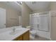 Neutral bathroom with a single sink vanity and combination tub and shower at 141 Fox Lake Ave, Las Vegas, NV 89148