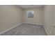 Neutral bedroom with a window, wall to wall carpeting and fresh paint at 141 Fox Lake Ave, Las Vegas, NV 89148