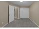 Carpeted bedroom with closet and entry to the Primary bath at 141 Fox Lake Ave, Las Vegas, NV 89148