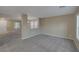 Neutral living room features a carpeted floor and large windows for lots of natural light at 141 Fox Lake Ave, Las Vegas, NV 89148