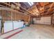 Spacious garage featuring a washer, dryer, and ample storage space, along with a two-car garage door at 1892 Maricopa Dr, Laughlin, NV 89029