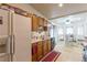View of the kitchen, dining area featuring lots of natural light, oak cabinets, and black appliances at 1892 Maricopa Dr, Laughlin, NV 89029