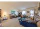 Comfortable living room with carpeted floors, bright lighting and comfortable seating area at 1892 Maricopa Dr, Laughlin, NV 89029