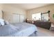 Comfortable main bedroom featuring carpeted floors, natural light, and ample closet space at 1892 Maricopa Dr, Laughlin, NV 89029