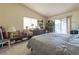 Bright main bedroom with carpeted floors, ample natural light, and dresser at 1892 Maricopa Dr, Laughlin, NV 89029