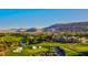 Breathtaking aerial view of Southern Highlands Golf Course surrounded by luxury homes and mountains at 20 Pebble Hills Ct, Las Vegas, NV 89141
