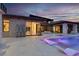Beautiful backyard with a pool, spa, patio, and lounge seating offering seamless indoor/outdoor living at 20 Pebble Hills Ct, Las Vegas, NV 89141