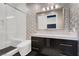 Beautiful bathroom featuring a walk-in shower, vanity, and designer wallpaper at 20 Pebble Hills Ct, Las Vegas, NV 89141