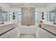 Large bathroom with soaking tub, separate vanities and striking lighting at 20 Pebble Hills Ct, Las Vegas, NV 89141