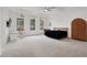 Bright bedroom with ample natural light, decorative hanging chair, and contemporary furnishings at 20 Pebble Hills Ct, Las Vegas, NV 89141