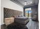Primary bedroom with a dark wood floor and tall tufted headboard at 20 Pebble Hills Ct, Las Vegas, NV 89141