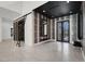 Grand foyer featuring high ceilings, unique wall decor and double doors to the exterior at 20 Pebble Hills Ct, Las Vegas, NV 89141