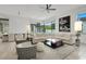 Spacious living room with a large sectional sofa, comfortable seating, and a view of the outdoor area at 20 Pebble Hills Ct, Las Vegas, NV 89141