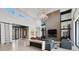 Gorgeous living room featuring soaring ceilings, clerestory windows, fireplace, and shelving at 20 Pebble Hills Ct, Las Vegas, NV 89141